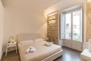 Giường trong phòng chung tại Terrazza Dei Sogni