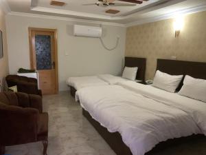 Postel nebo postele na pokoji v ubytování swat view hotel