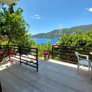 a balcony with a view of the water at Villa Delfini in Vasiliki