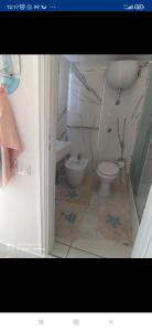 a bathroom with a toilet and a sink at Casa privata vacanze Relax piazza Maria Anania vico n4 in Crotone