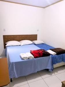 Un ou plusieurs lits dans un hébergement de l'établissement Pousada 4 estações