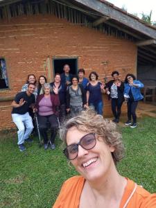 a woman standing in front of a group of people at Pousada Rural Ouro Verde in Eldorado