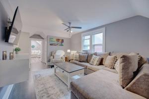 a living room with a couch and a table at Trendy Getaway: Pet-Friendly + 5 Min to Downtown in Milwaukee