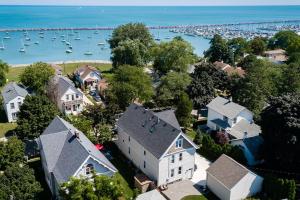 an aerial view of a house and a harbor with boats at Trendy Getaway: Pet-Friendly + 5 Min to Downtown in Milwaukee