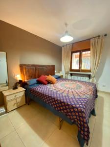 a bedroom with a bed and a dresser and a mirror at Bungalow Steps from Moraira in Teulada +41 photos