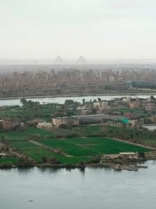an aerial view of a city next to a river at شقة راقية مطلة علي كورنيش النيل المعادي - عوائل فقط in Cairo
