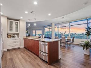 a kitchen and dining room with a view of the city at 4Bedroom/ 2bath 2100sq ft Thorton Park Master Suite in Orlando