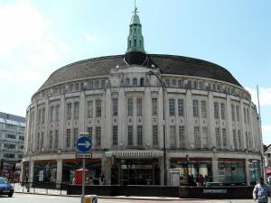 a large building with a clock tower on top of it at Large Morden 1 Bed Apartment London Catford Lewisham with great transport links in London