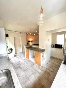 a kitchen with a sink and a counter top at Cosy suite in the heart of Ebene in Quatre Bornes