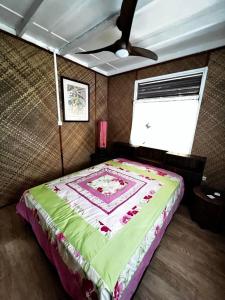 Кровать или кровати в номере TAHITI - Fare Rau Piti