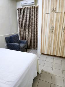 Postel nebo postele na pokoji v ubytování Osu Apartment