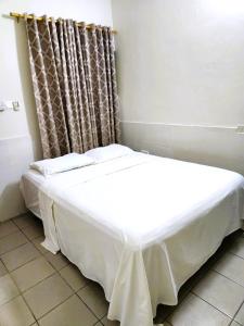 Postel nebo postele na pokoji v ubytování Osu Apartment