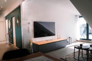 Et tv og/eller underholdning på Luxusapartment in Backnang mit Wellness