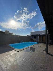 a swimming pool on the roof of a house at Espaço de lazer 3E in Dourados