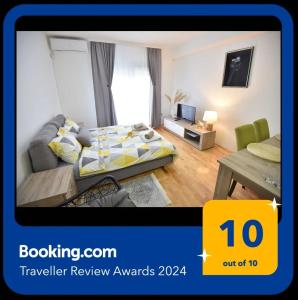 a hotel room with a bed and a table at Studio 13 in Kragujevac