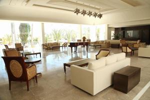 a living room with couches and chairs and a table at Iberostar Selection Diar El Andalous in Port El Kantaoui