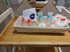 a box of toiletries on a table in a bathroom at Cá del Manöl in Villa di Tirano +16 photos