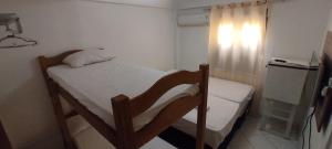 Posteľ alebo postele v izbe v ubytovaní Pousada Zumbi dos Palmares