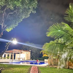 a fire truck extinguishing a swimming pool at night at Ecofinca San José in Carmen de Apicalá