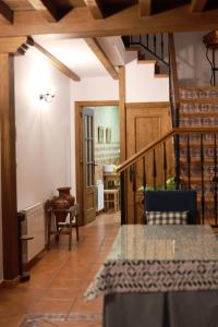 a hallway with a staircase in a house at Casa rural La Aldea in Cabezuela del Valle