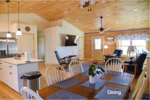 a kitchen and dining room with a table and chairs at Mountain Views! Copper Cannon Lodge in Franconia in Franconia