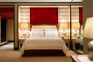 Postel nebo postele na pokoji v ubytování Encore at Wynn Las Vegas