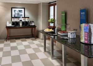 a hotel room with a counter with food on it at Hampton Inn & Suites Davenport in Davenport