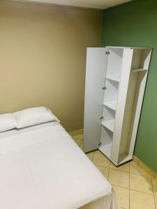 Postel nebo postele na pokoji v ubytování La Casita