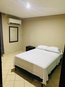 Postel nebo postele na pokoji v ubytování La Casita