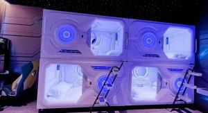 a purple room with four beds in it at Limin Hostel Capsules in Valencia