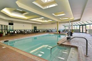a large swimming pool in a hotel lobby at Hampton Inn Kalispell in Kalispell