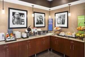 a kitchen with a counter with food on it at Hampton Inn Findlay in Findlay