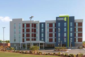 a large building with a home depot sign on it at Home2Suites by Hilton Florence in Florence