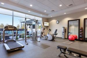 a gym with treadmills and exercise equipment in a building at Home2Suites by Hilton Florence in Florence