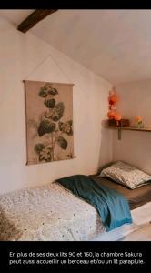 Кровать или кровати в номере Cocon cosy et déconnecté 30min Puy du Fou - 2 chambres et 1 canapé lit