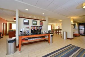 a lobby with a bar in the middle of a building at Hampton Inn Farmville in Farmville