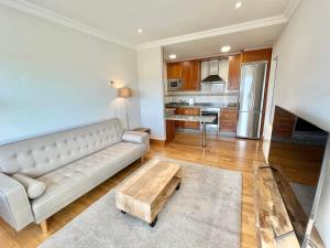 a living room with a couch and a coffee table at Coruña House in A Coruña