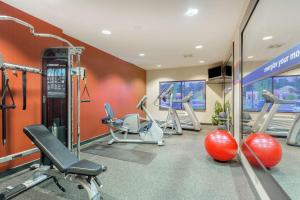 a gym with several exercise equipment in a room at Hampton Inn Auburn in Auburn