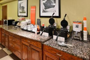 a counter in a hotel room with a counter top with a counter at Hampton Inn & Suites Greenville in Greenville