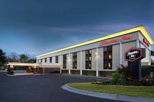 a hotel with a sign in front of it at Hampton Inn Gainesville in Gainesville