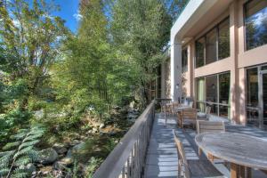 a balcony with a table and chairs and trees at Hampton Inn Gatlinburg in Gatlinburg