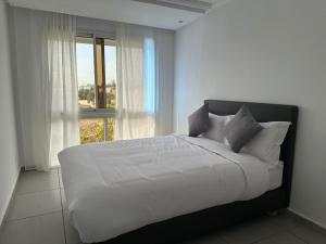 Postel nebo postele na pokoji v ubytování Residence Neya Harhoura