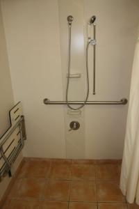 a shower stall in a bathroom with a tiled floor at Hampton Inn Guntersville in Guntersville