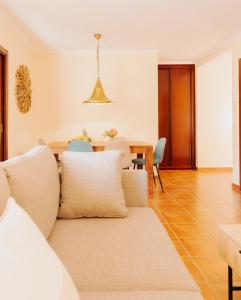 a living room with a couch and a table at La Tejita Ocean Villa in Granadilla de Abona