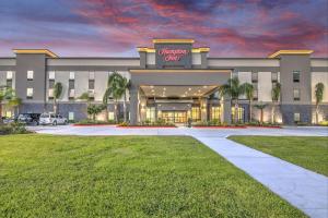 a rendering of the entrance to a shopping center at Hampton Inn Houston NASA-Johnson Space Center in Seabrook