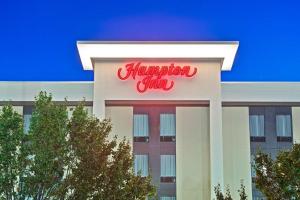 a sign for a hampton inn on top of a building at Hampton Inn Huntington/Barboursville in Barboursville