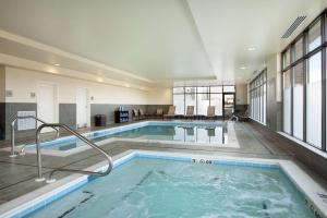 a large indoor pool with a hot tub at Hampton Inn & Suites Charles Town in Charles Town