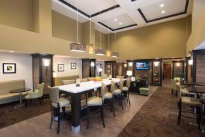 a large dining room with a large table and chairs at Hampton Inn & Suites Crawfordsville in Crawfordsville