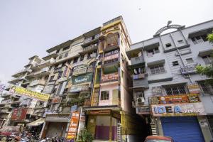 a tall building with lots of signs on it at Hotel O Suvidha in Jamshedpur +34 photos