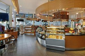 a bakery with a bunch of pastries on display at Bahia Mar Fort Lauderdale Beach - DoubleTree by Hilton in Fort Lauderdale